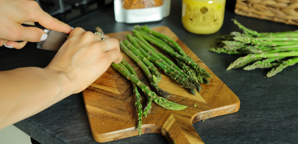 Asparagus with fried egg on ghee butter and crunchy Spicy Seeds